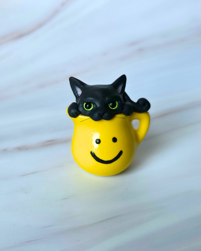 Black cat in Pitcher Hand Scuplted Clay Collectible