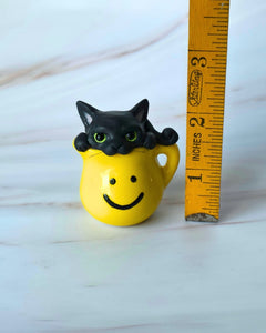 Black cat in Pitcher Hand Scuplted Clay Collectible