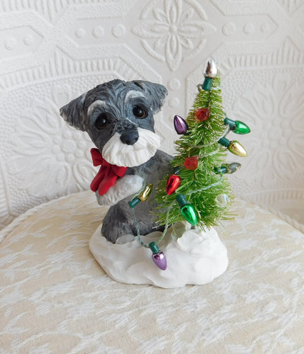Schnauzer Decorating the Christmas tree Hand Sculpted Collectible