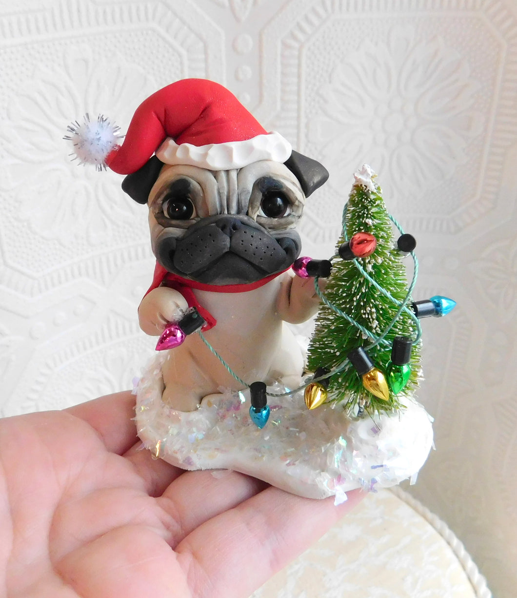 Christmas Pug trimming the tree Hand Sculpted Collectible