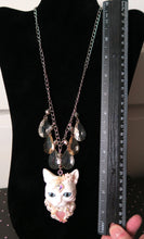 Load image into Gallery viewer, White Cat with Butterflies, Flowers, Feathers, and Crystals Painted Pendant Necklace