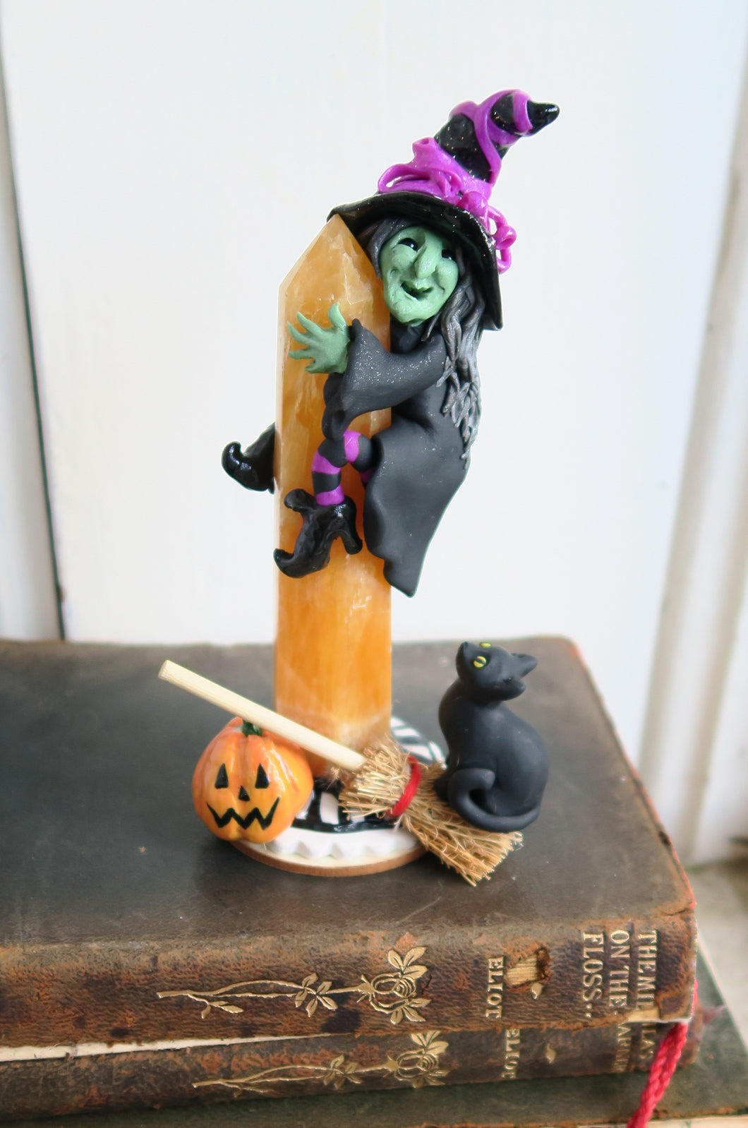 Witch hugging Calcite Tower with Cat & Pumkin Hand Scuplted Clay & Crystal Collectible